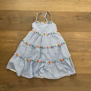 Girls midi dress with colorful pom-poms